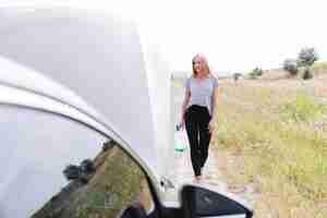 Free photo long shot of woman on road