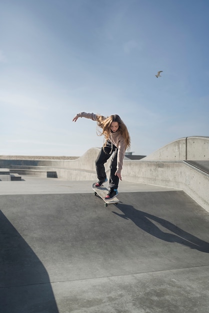 Long shot woman on skateboard