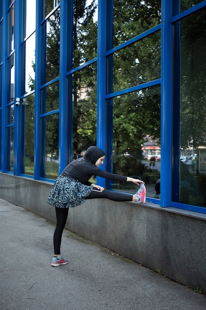 Long shot of woman stretching