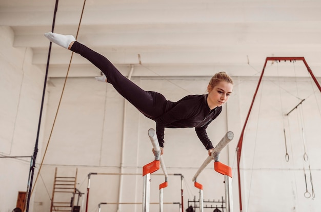 Long shot woman training for gymnastics championship