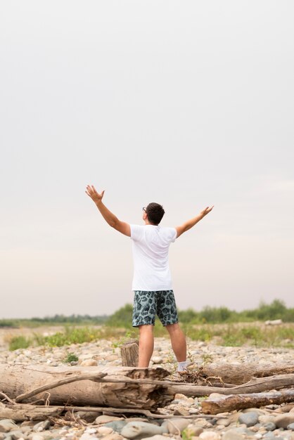 Long shot of young man looking away