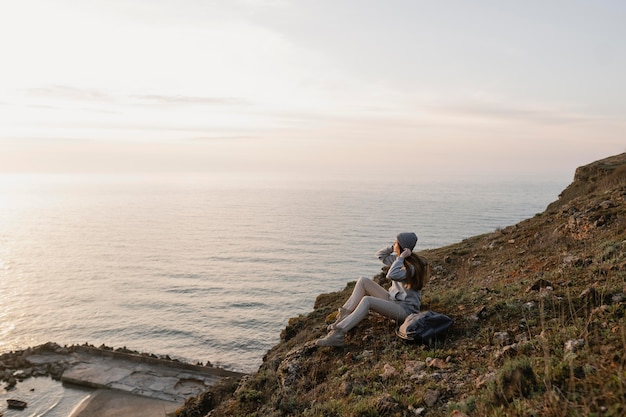 Long shot of young woman enjoying the peace around her