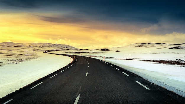 long straight road at sunset in winter.