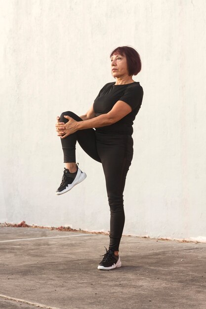 Long view of confident asian woman doing sport