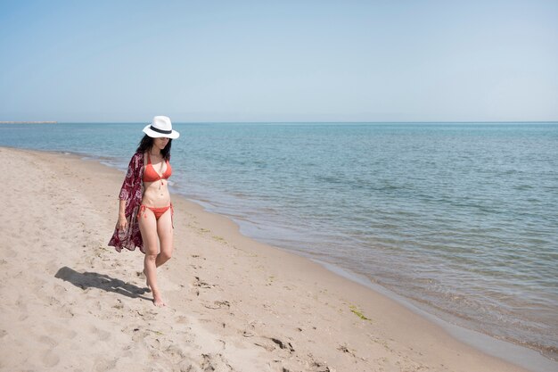 Long of woman walking at the beach