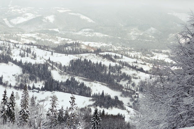 Look from above at dreamy mountains covered with snow 