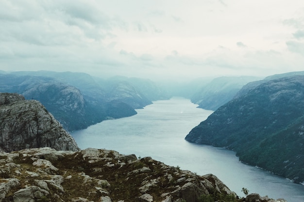 Look from above at sun shining over the fjord