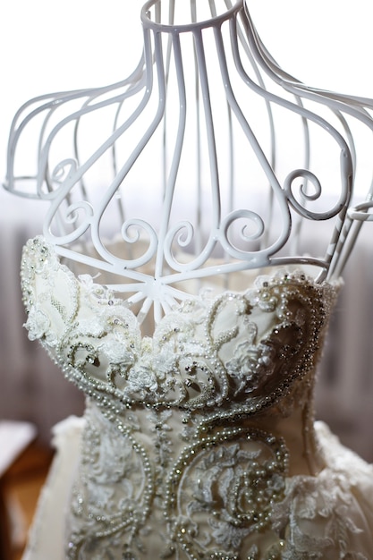 Look from above at white mannequin with gorgeous wedding dress 