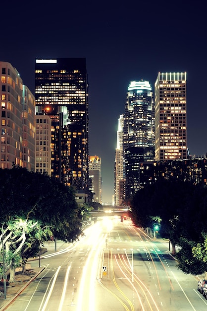 Los Angeles downtown at night with urban buildings and light trail