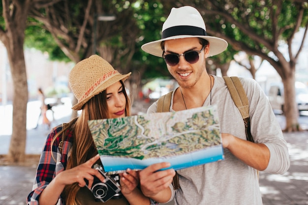 Lost tourists looking at the map