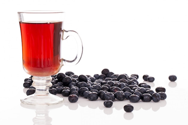 Lots of blueberries and a glass of tea