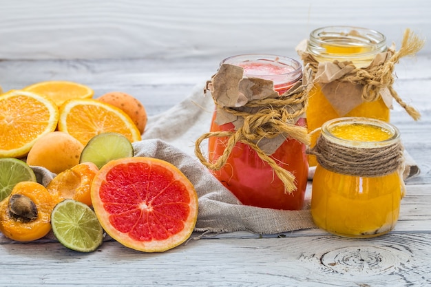 Lots of fresh fruit, cut on wooden wall, drink, healthy food