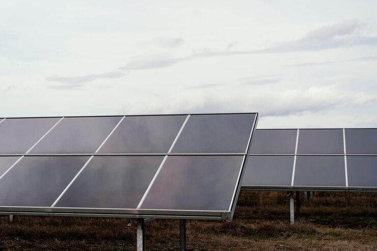 Free Photo lots of solar panels in the field generating electricity with copy space