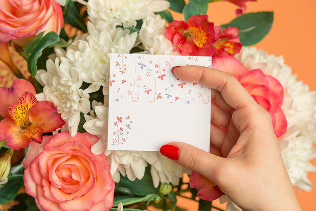 Love background with pink roses, flowers, gift on table