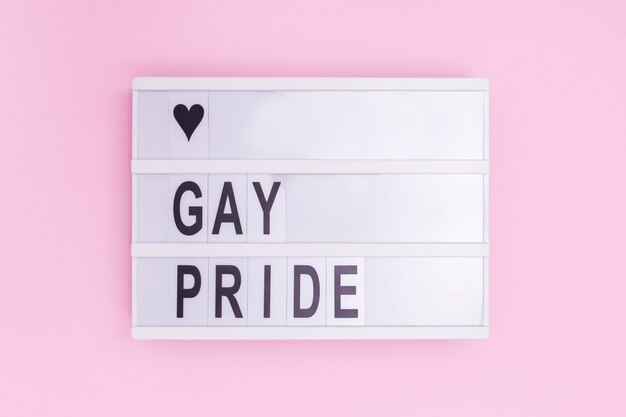 Love gay pride light box message on pink background