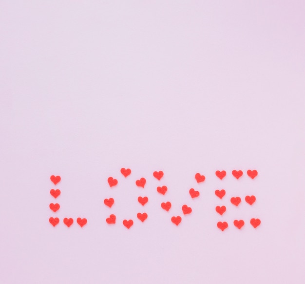 Love inscription from small hearts