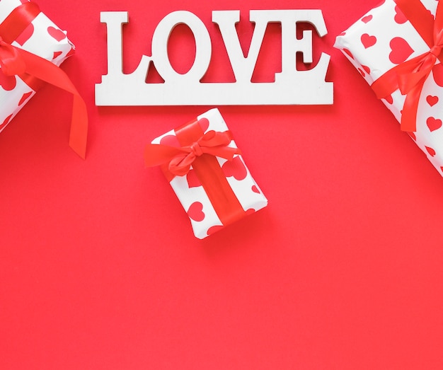 Free photo love inscription with gift boxes