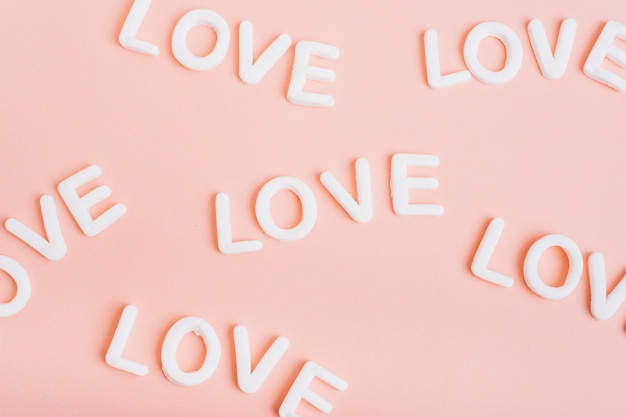 Love inscriptions on pink table