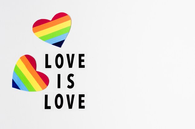 Love is love concept with hearts in rainbow colors