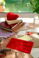 Free photo love letter of note with collection of romantic stationery