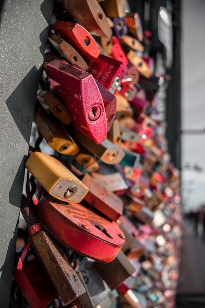 Love padlocks on metallic railing