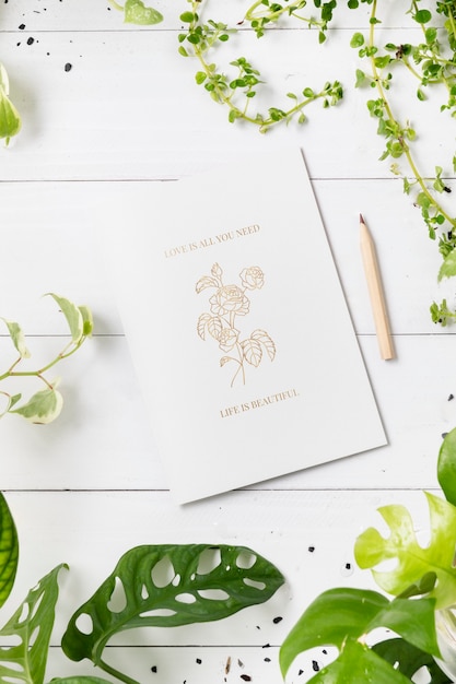 Free photo love quote and rose drawing on white paper