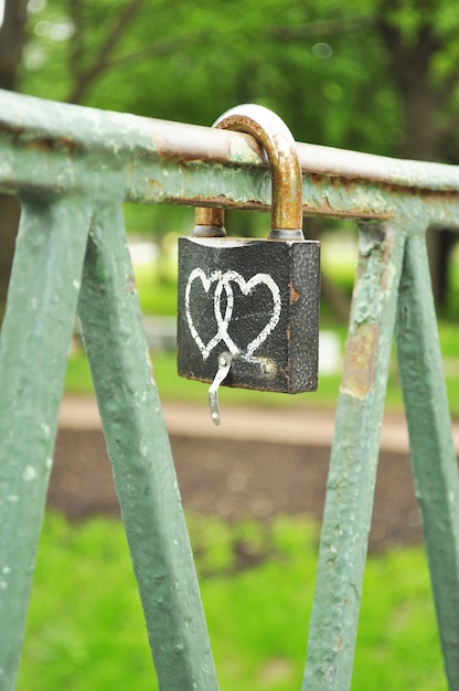 Free photo love symbol lock on the bridge
