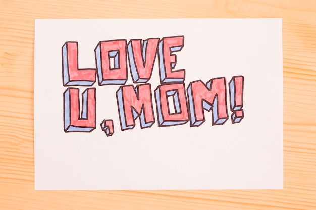 Free photo love u mom writing on paper