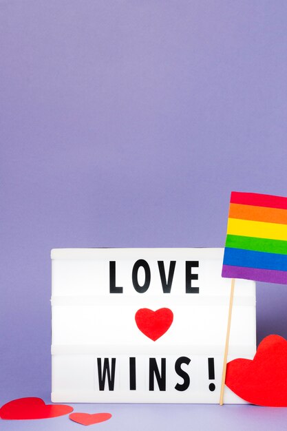 Love wins with rainbow colored flag