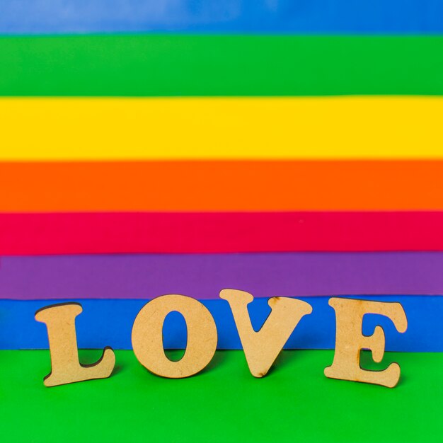 Love wooden word and LGBT flag