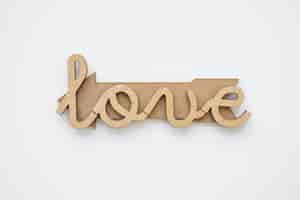 Free photo love writing on wooden arrow