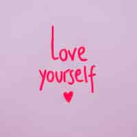 Free photo love yourself inscription on purple background