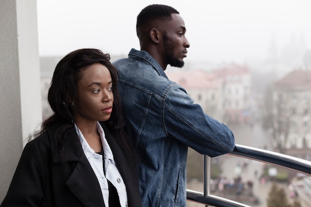 Lovely afroamerican couple on balcony