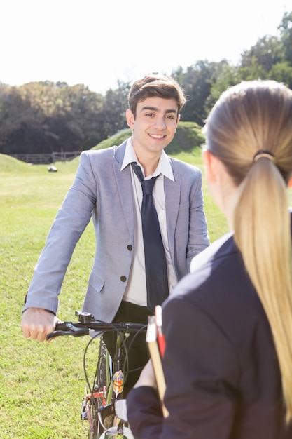 Lovely boy talking to a classmate