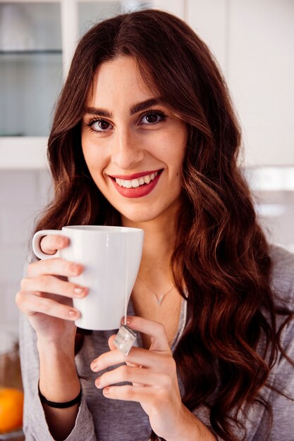 Lovely brunette with tea