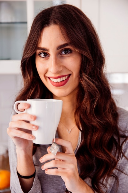 Lovely brunette with tea