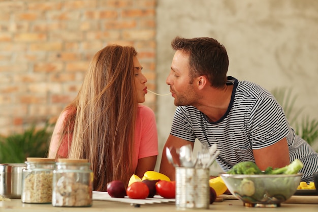 Lovely couple eating spaghetti