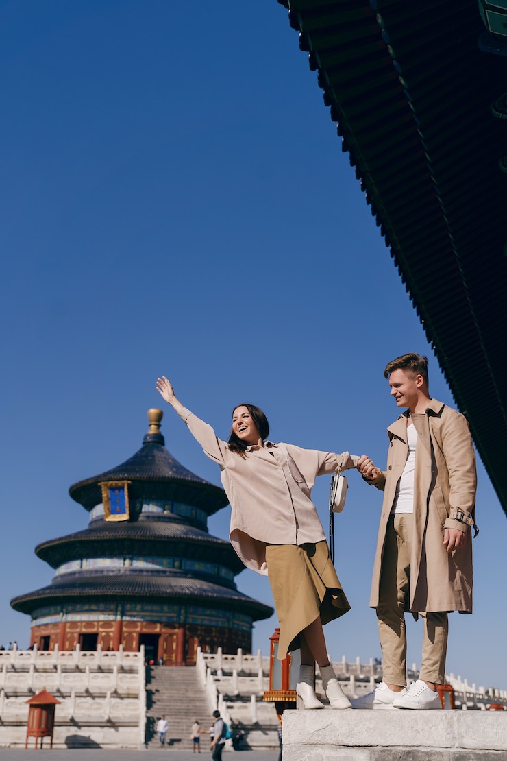 Free Photo lovely couple exploring tourist attractions in beijing china