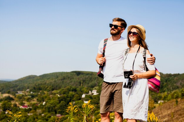 Lovely couple looking away and holding each other