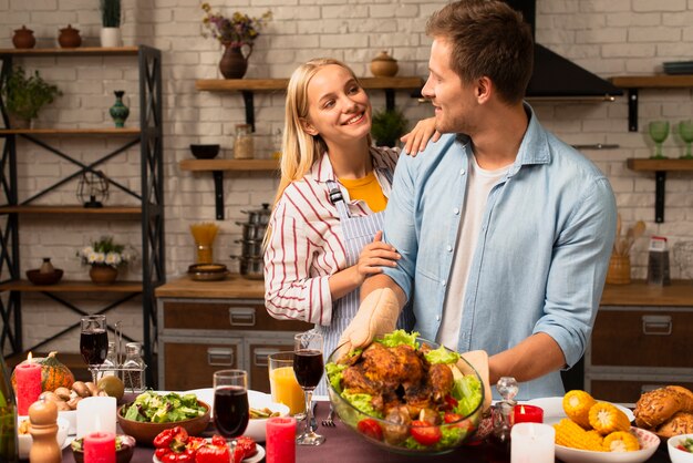 Lovely couple looking at each other in the kitchen