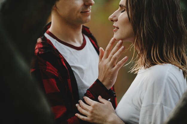 The lovely couple in love embracing in the park