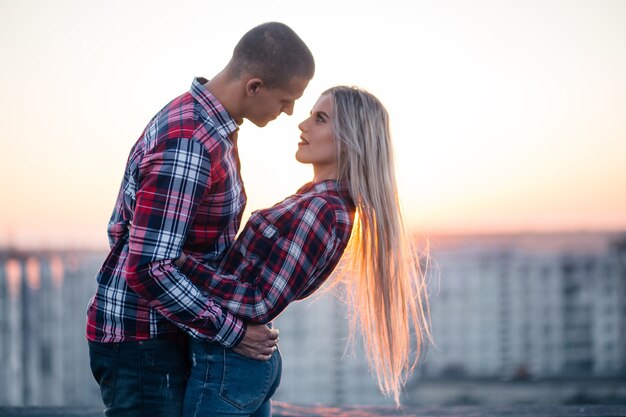 The lovely couple in love looking at each other