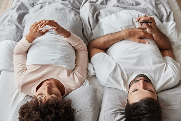 Lovely couple sleeping in comfortable bed