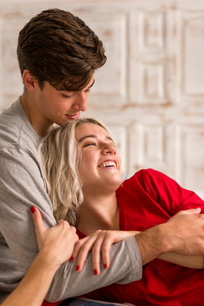 Lovely couple smiling and hugging