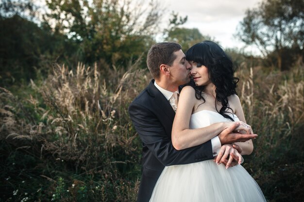 Lovely couple spends time in the field .Taken at sunset with natural light