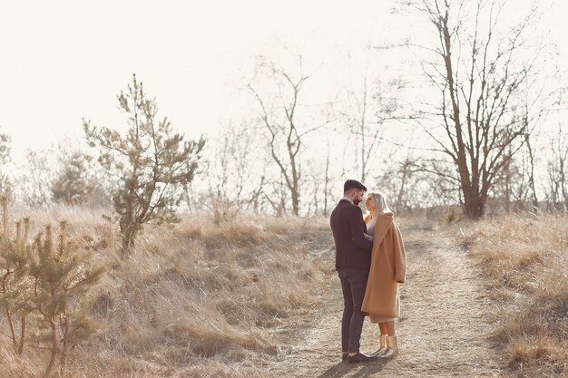 Lovely couple in a spring field