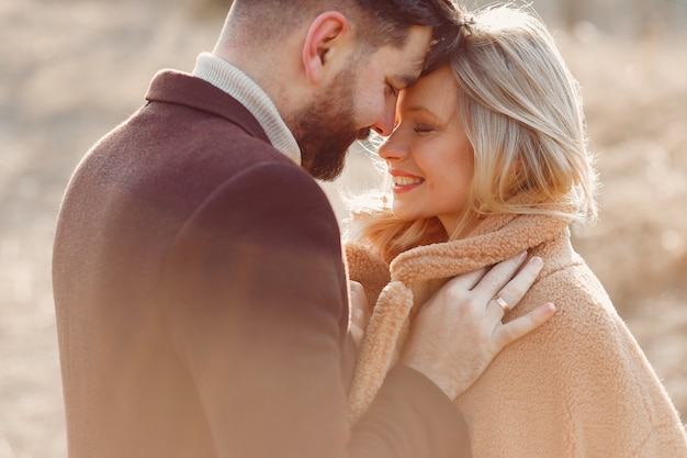 Lovely couple in a spring field