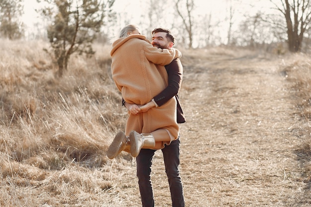 Lovely couple in a spring field