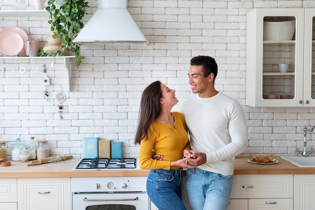 Free photo lovely couple together in kitchen