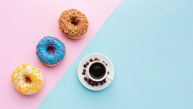 Lovely donuts and coffee copy space